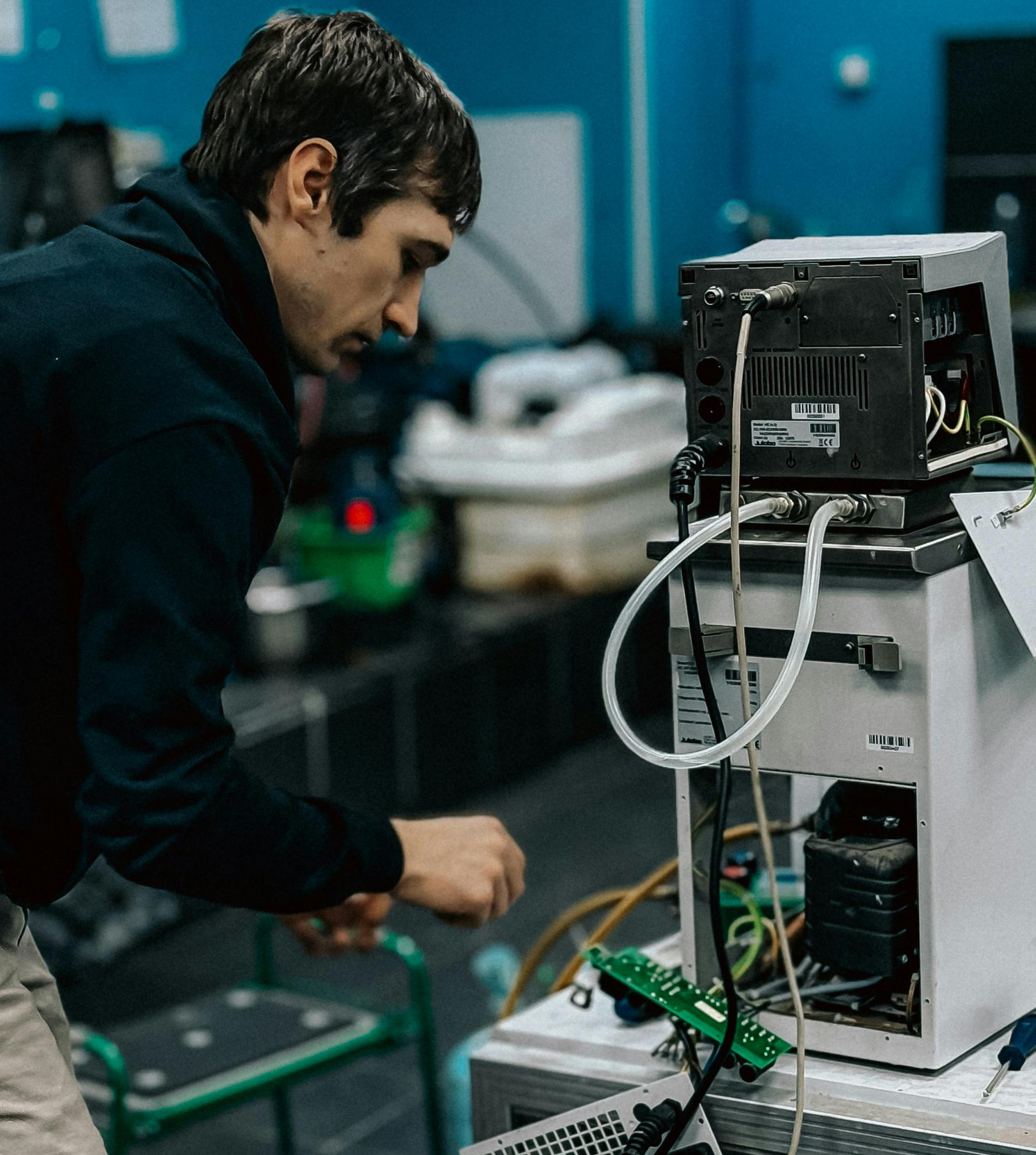 Biomedical technician servicing medical equipment